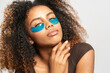 © Gonzalo Infiesta - Young woman applying under eye patches for skincare routine