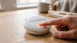 © SL Creations - Counselling button on smart speaker, customer support gesture, help request interface, finger pressing call button, teletherapy concept, tech service icon