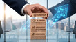 © Shahid - Businessman stacking wooden blocks with strategy planning execution and resources text for corporate growth