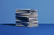 © mik47 - Tall Stack Of Folded Daily Newspapers On Blue Background