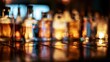 © Aleksey - Blurred amber liquor bottles with glowing reflections on a dark bar counter, creating a warm, moody autumn hospitality background for nightlife and beverage designs.