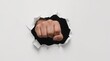 © Bonsales - Fist punching through white paper, breaking barrier, expressing power, strength, and overcoming challenges