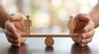 © Working Moments - A wooden seesaw with male and female figures achieving perfect gender parity and balance.