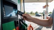 © Viktor - Man pays for fuel using contactless credit card at gas station. Wireless payment terminal processes transaction. Driver uses smart tech for easy gas purchase.