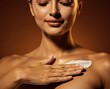 © Veloura Studio - Skincare routine features a person gently applying a rich white moisturizing cream to their chest and collarbone.