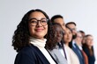 © Mark - Diverse group of smiling young professionals standing in line against a clean white background