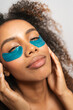 © Gonzalo Infiesta - Young woman enjoying under eye patches skincare routine