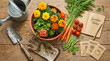 © Mr.Wazeer - Rustic gardening flat lay with marigold flowers, fresh vegetables, garden notes journal and vintage tools on wood
