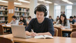 © patricia - Young man learning with laptop and headphones in library