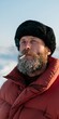 © Andrii Zastrozhnov - Bearded man in fur hat smoking closeup portrait in snowy landscape for winter background poster and editorial use