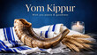 © olgakris - Shofar on tallit with wheat plus glowing candle beneath yom kippur greeting, jewish holiday still life, peaceful atonement message