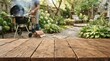 © FryArt - Rustic wooden tabletop with blurred background of garden barbecue party