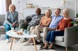 © Prostock-studio - Smiling Senior Group Of Five Mixed Gender And Ethnicity Relaxing Together On Sofa At Cozy Home, Engaging In Joyful Conversation And Enjoying Snacks, Creating A Warm And Inviting Atmosphere.
