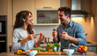 © Alla - Happy couple cooking healthy dinner together in a modern kitchen at home
