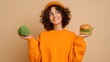 © M - Healthy food choice concept, woman holding broccoli and burger, nutrition balance dilemma