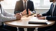 © Faisal shah  - Professional lawyers and client in legal consultation meeting at office desk