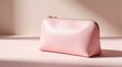 © Maryna - Pink cosmetic pouch with gold zipper sits on pastel surface. Minimalist beauty bag for makeup skincare products. Elegant feminine accessory for travel daily use in studio setting. Clean aesthetic for
