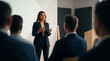 © Mahmud - Professional businesswoman giving a presentation to a group of colleagues in a modern office meeting room