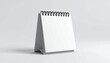 © Bediha Duru Öksüz - Minimalist blank desk calendar template with black wire-o spiral, copy space.