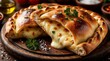 © miss irine - Two calzones stuffed with melted mozzarella cheese served on wooden board. Baked dough halves reveal gooey cheese filling. Fresh parsley garnishes pasta dish. Tasty Italian food.