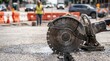 © Wahyu - Industrial asphalt saw cutting road at city construction site.