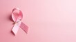 © s2rd studio images - Pink awareness ribbon on a soft pink background symbolizing breast cancer awareness, support, hope, and solidarity, with ample copy space for campaigns and healthcare messages.