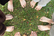 © Tereza - Children are standing barefoot on the grass,