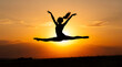 © Fakhrurozi - Silhouette of ballerina dancer leaping against vibrant sunset sky