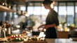 © CreativeArt - Woman cooking in a modern home kitchen preparing healthy food ingredients in a blurred morning light setting