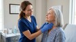© HIJRAH - Doctor Examining Senior Patient's Throat With Gentle Care In Clinic