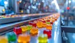 © João Macedo - Gummy candies moving on industrial factory conveyor belt