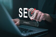 © panya7 - SEO and AI search optimization concept with target icon and person using laptop, representing website ranking, digital marketing, search strategy, online visibility and traffic growth.