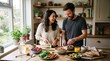 © DR Moura - Happy couple preparing a healthy breakfast together in a bright kitchen with fresh ingredients and plants
