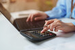© Joi_studio - Accountant working with calculator, laptop and financial documents for accounting, business finance, budget planning, financial analysis, expense management, bookkeeping and financial reporting