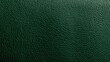 © Anat art - The emerald green leather texture displays a fine grain and rich saturation, providing a luxurious backdrop for design uses.