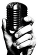 © Varadilladtr - Hand holding a vintage retro microphone for singing, podcasting, or public speaking events.