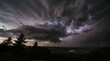 © FLAMINGOS - Dramatic Dark Storm Clouds Moving Fast with Lightning Flashes Background