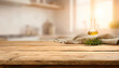 © り た - Rustic wooden table background with soft focus kitchen interior for food product display and packaging