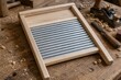 © vlntn - Wooden Washboard on a Rustic Workbench with Hand Tools Nearby