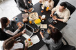 © Pixel-Shot - Group of business people having lunch at table in office, top view