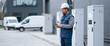 © perfectlab - Electrician inspecting control panels outdoors