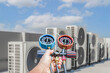 © bancha - Air conditioning, HVAC service technician using gauges to check refrigerant and add refrigerant.