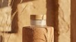 © rezaul4022 - Natural cosmetic jar with wooden cap on podium surrounded by dry grass in warm sunlight