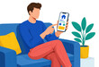 © SerPak - Young man points at a mobile banking app while sitting on a blue sofa at home, with a potted plant and colorful interior accents.