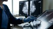 © l1gend - Mammography technologist reviewing a patient prior mammogram images before beginning a new screening