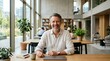 © olga_demina - A smiling man sits in a modern office with a laptop, unaware that a corporate disaster is about to strike his business from afar, creating tension amidst a bright day