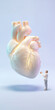 © master1305 - Older man gesturing toward giant anatomical human heart on pastel background. Concept of cardiovascular health, healthy aging and heart disease prevention.