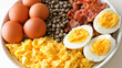 © Sabana - Bowl filled with various egg dishes including boiled eggs and scrambled eggs