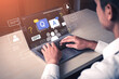 © InfiniteFlow - Young Professional Engaged in Online Communication with Question and Answer Interface on Laptop Display in Modern Office Setting. Bitwise.