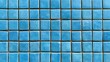 © Anat art - Blue mosaic tiles show variations in glaze and texture. They are arranged in a neat geometric pattern, ideal for wall or floor decor.